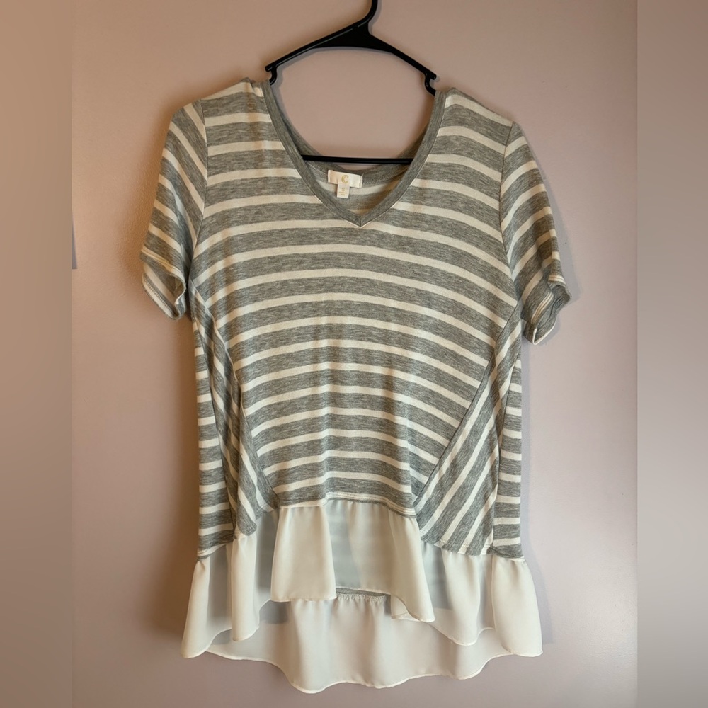 Tunic top with ruffle brand is C